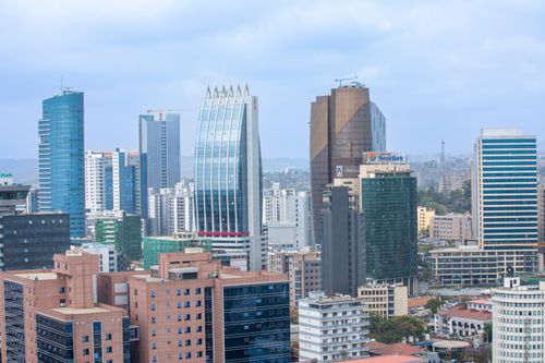 Free Aerial view of Addis Ababa's modern skyline with skyscrapers under a cloudy sky. Stock Photo