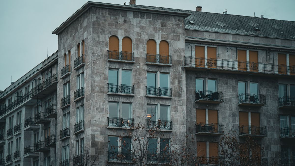 A moody, historic apartment building in Budapest, Hungary with architectural charm.