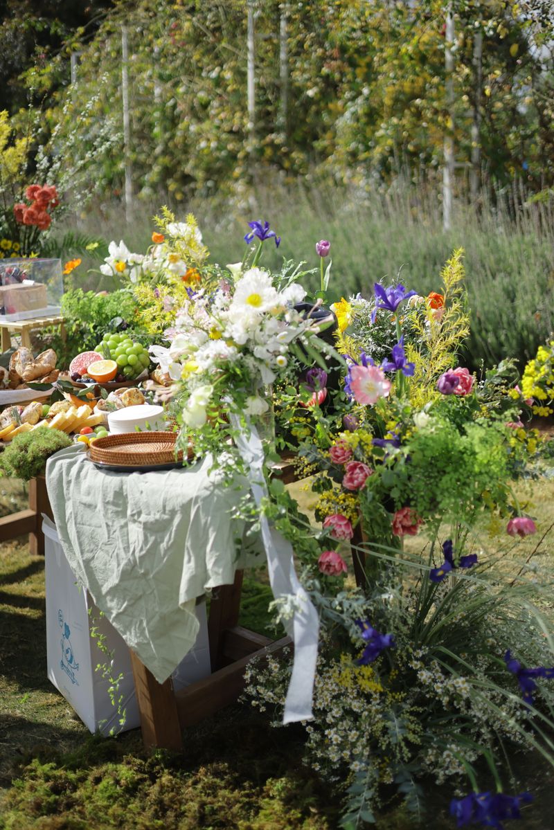 Vibrant outdoor spring celebration with floral decorations and joyful atmosphere