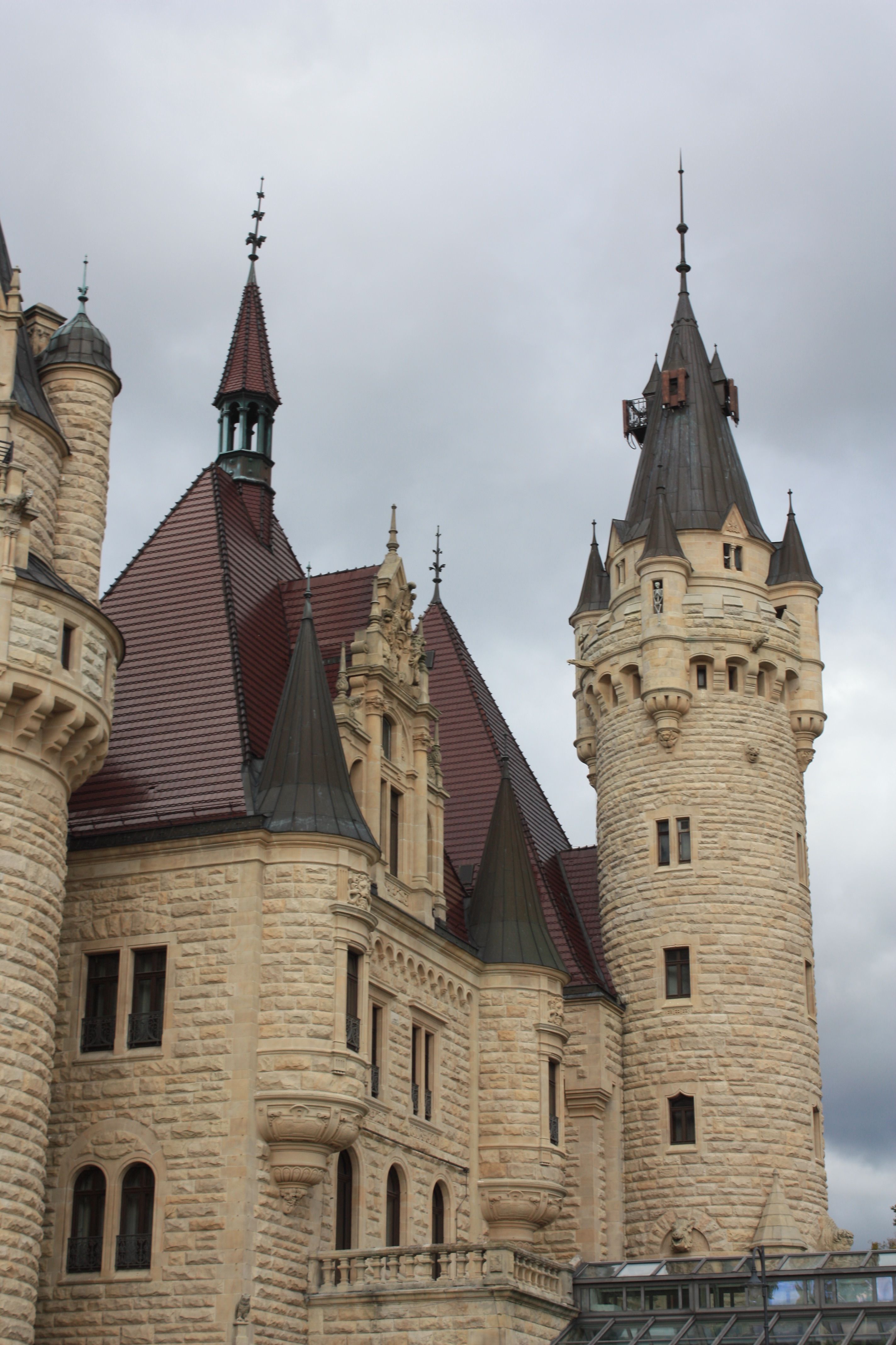 Majestic Castle Towers Against Cloudy Sky · Free Stock Photo