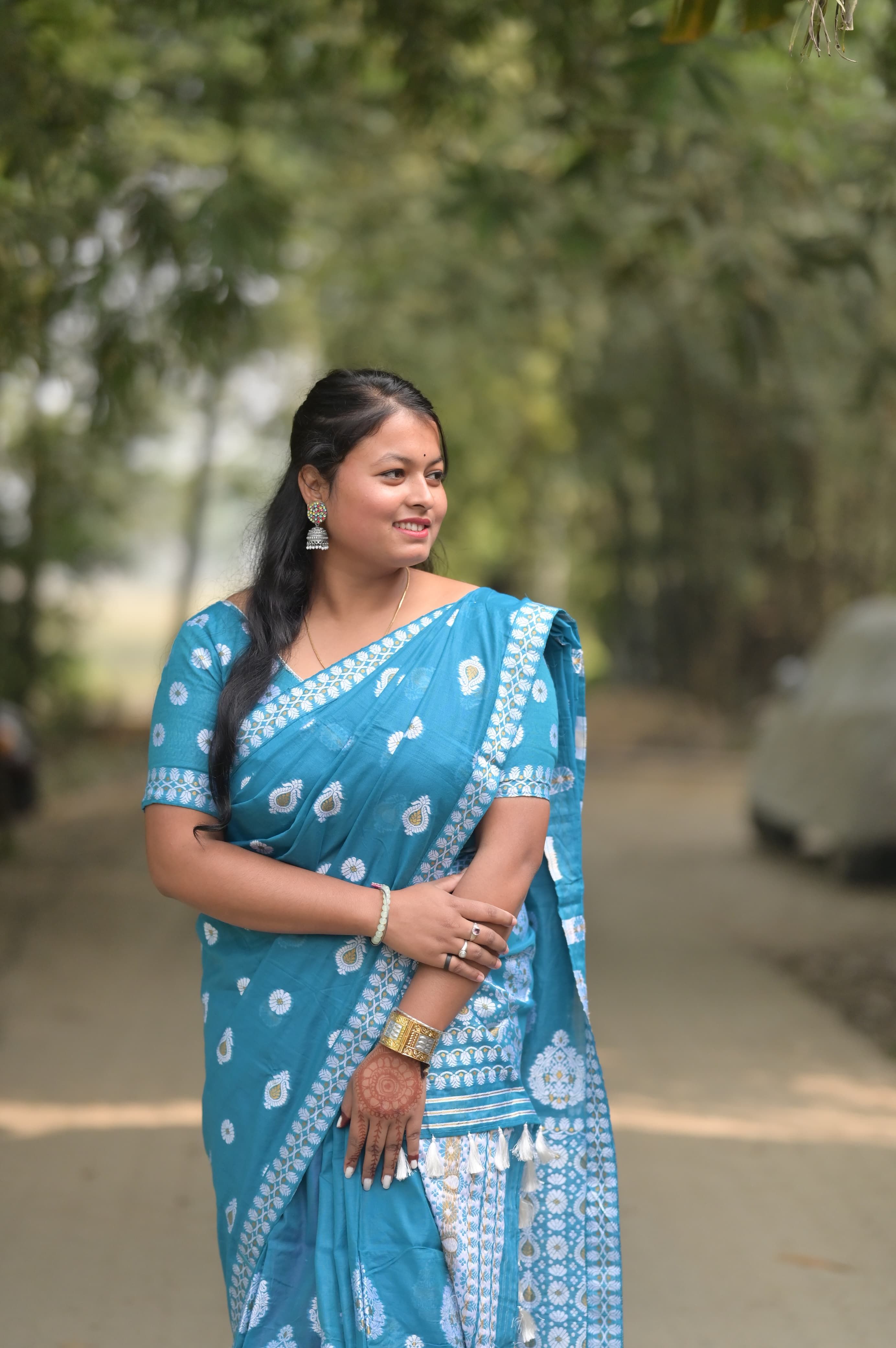 Woman in Blue Sari Posing Outdoors Peacefully · Free Stock Photo