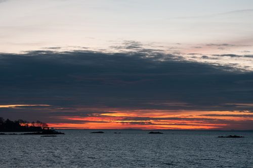 Free Stunning sunrise at Cove Island Park in Stamford, Connecticut, highlighting vibrant colors over the ocean. Stock Photo