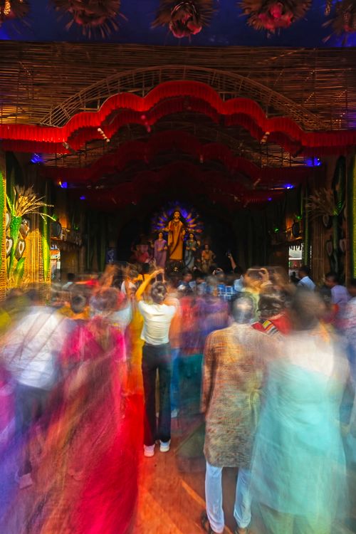 Free Blurred motion capture of a colorful Durga Puja festival crowd in Kolkata, India. Stock Photo
