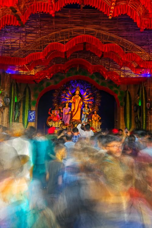 Free Colorful celebration of Durga Puja with blurred crowd in Kolkata, India, capturing festive energy. Stock Photo