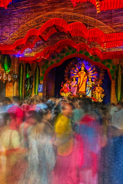 Free Colorful Durga Puja festival with blurred crowd in Kolkata, India. Stock Photo