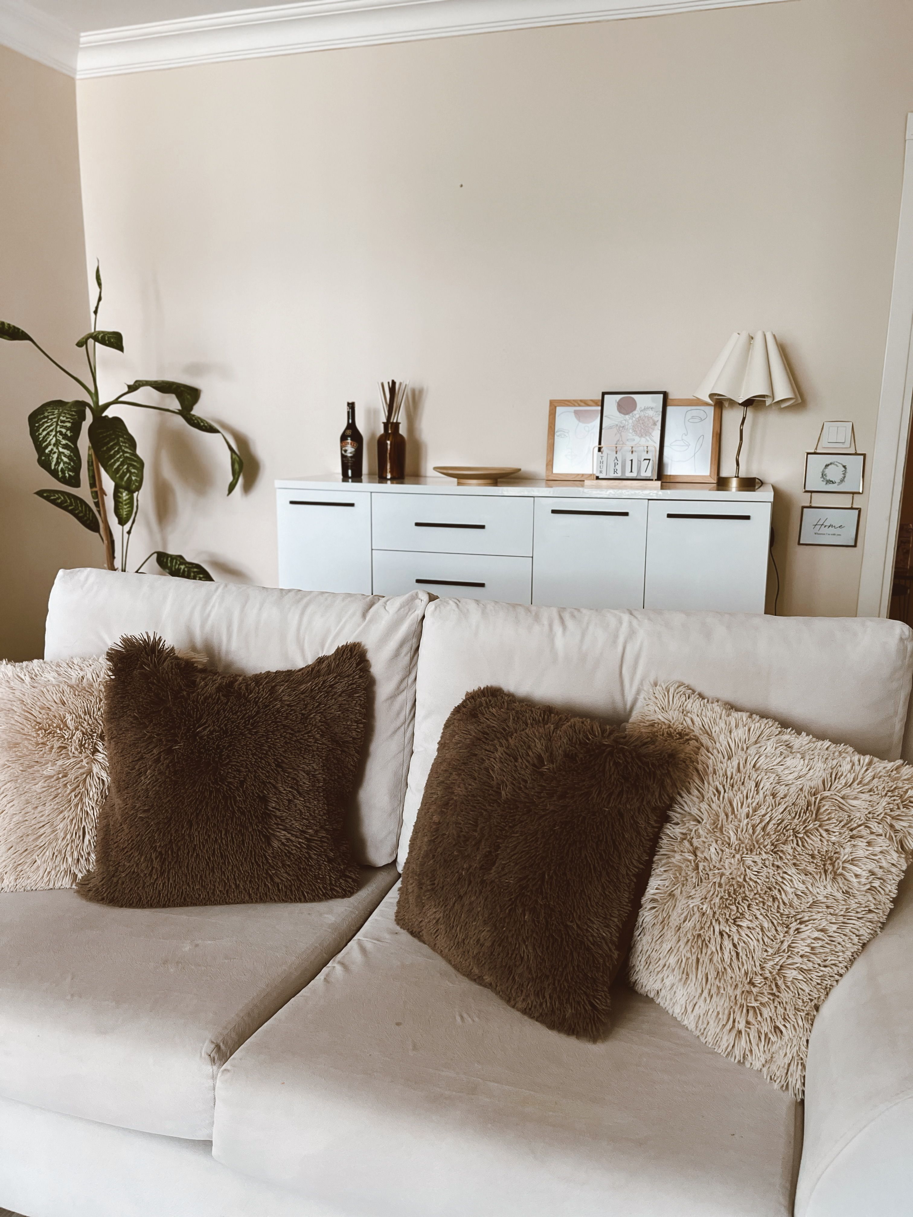 Cozy Living Room with Sofa and Cushions · Free Stock Photo