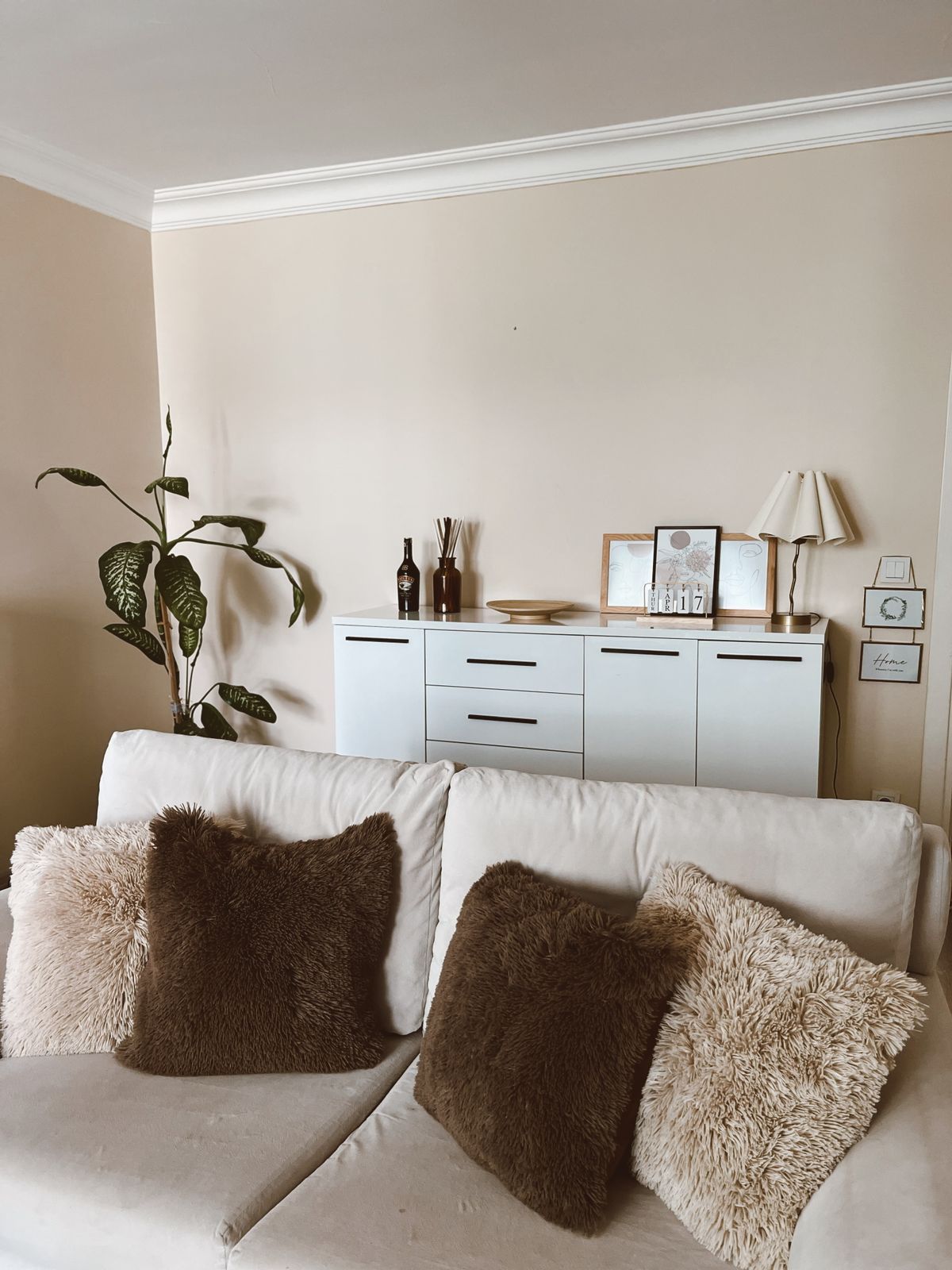 Cozy living room with neutral tones and soft cushions