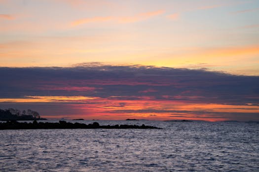 A breathtaking ocean sunrise with vibrant colors and serene waters.