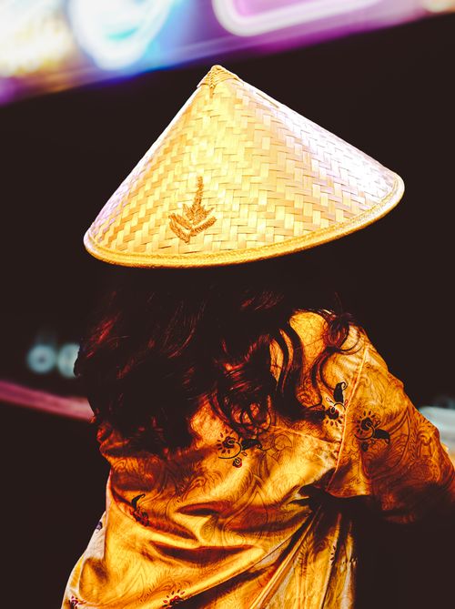 Free Vibrant image of a person wearing a traditional Asian conical hat, emphasizing cultural attire. Stock Photo
