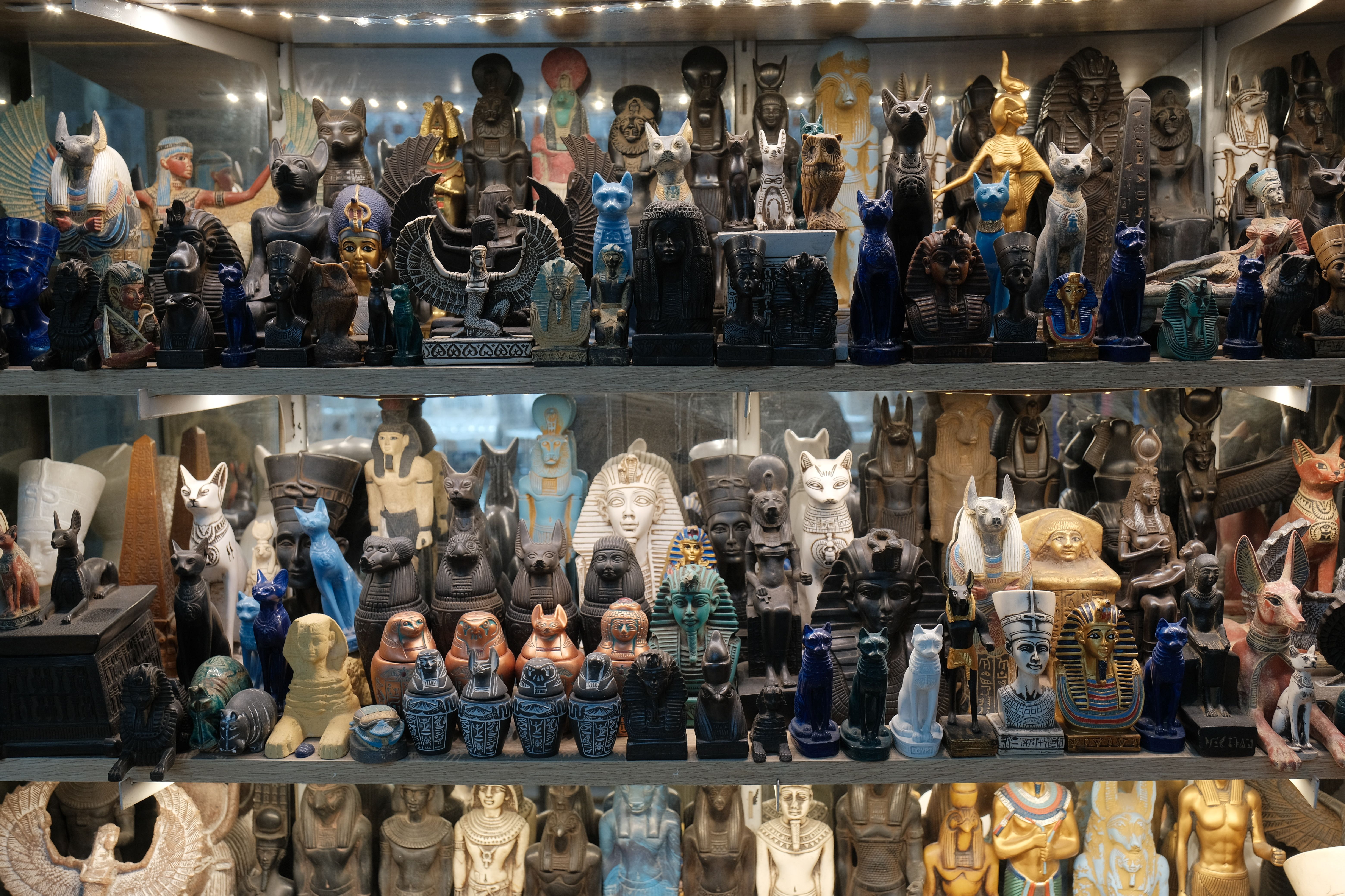 Colorful Egyptian Statues and Artifacts Display · Free Stock Photo
