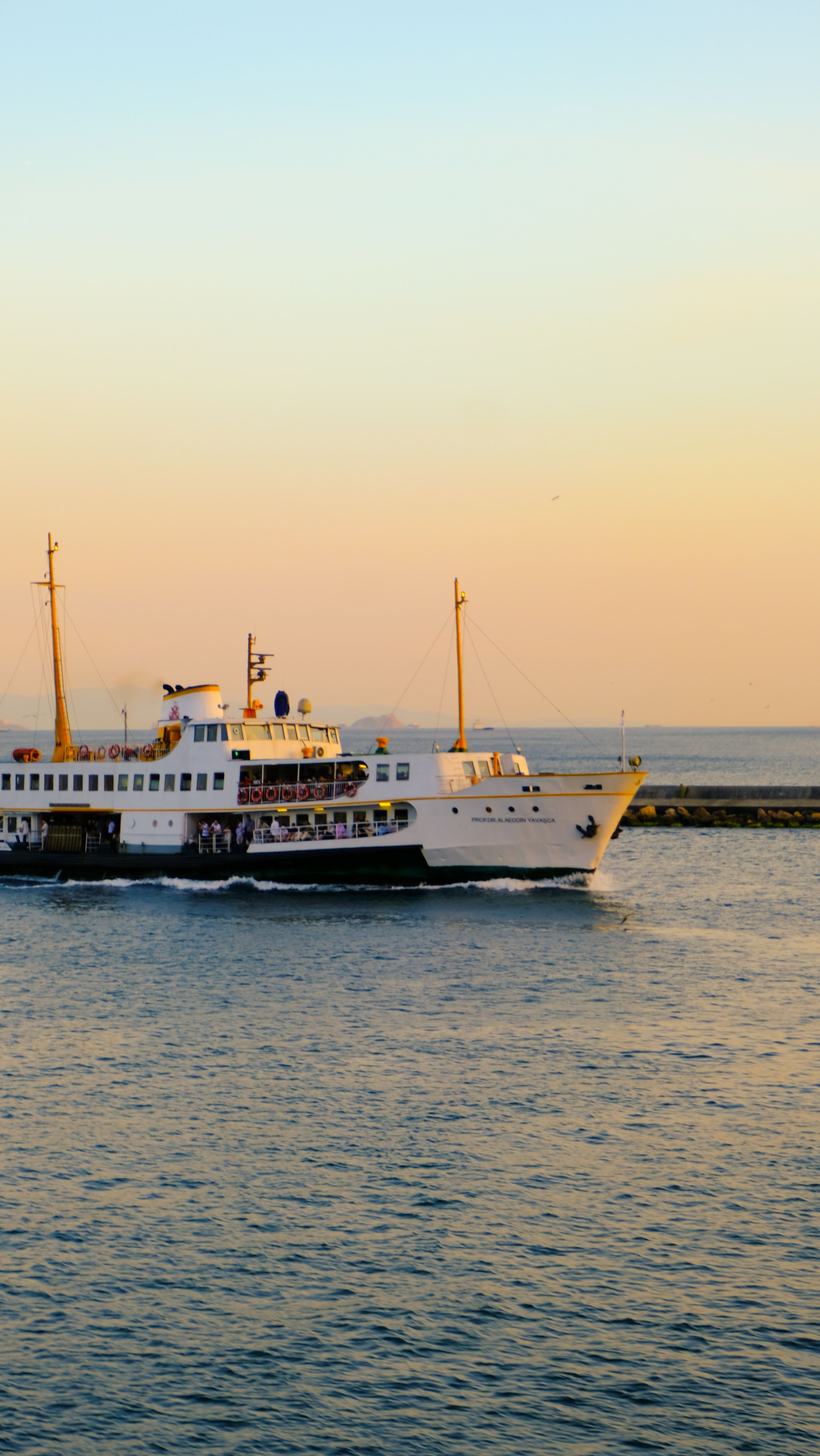 Scenic Ferry Ride During Sunset on Calm Sea · Free Stock Photo