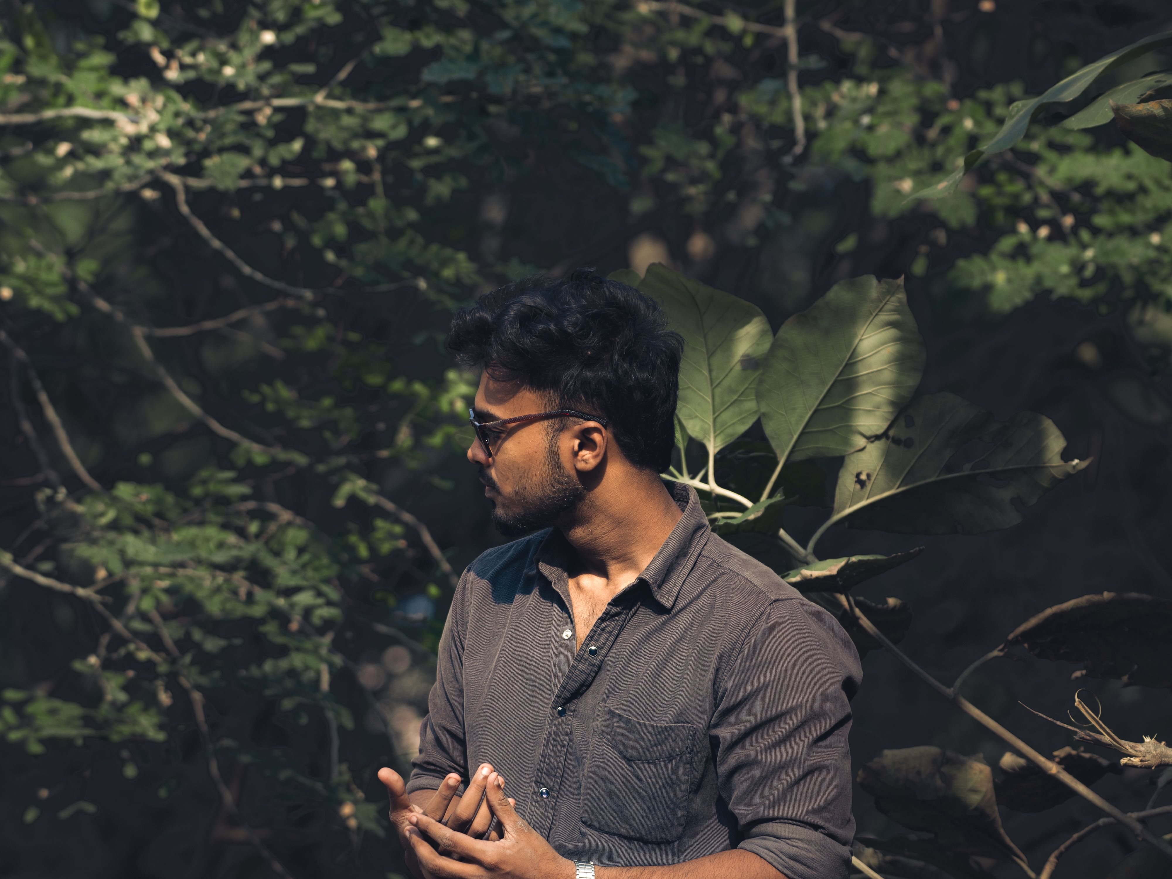 Man in Forest with Sunglasses and Dark Shirt · Free Stock Photo