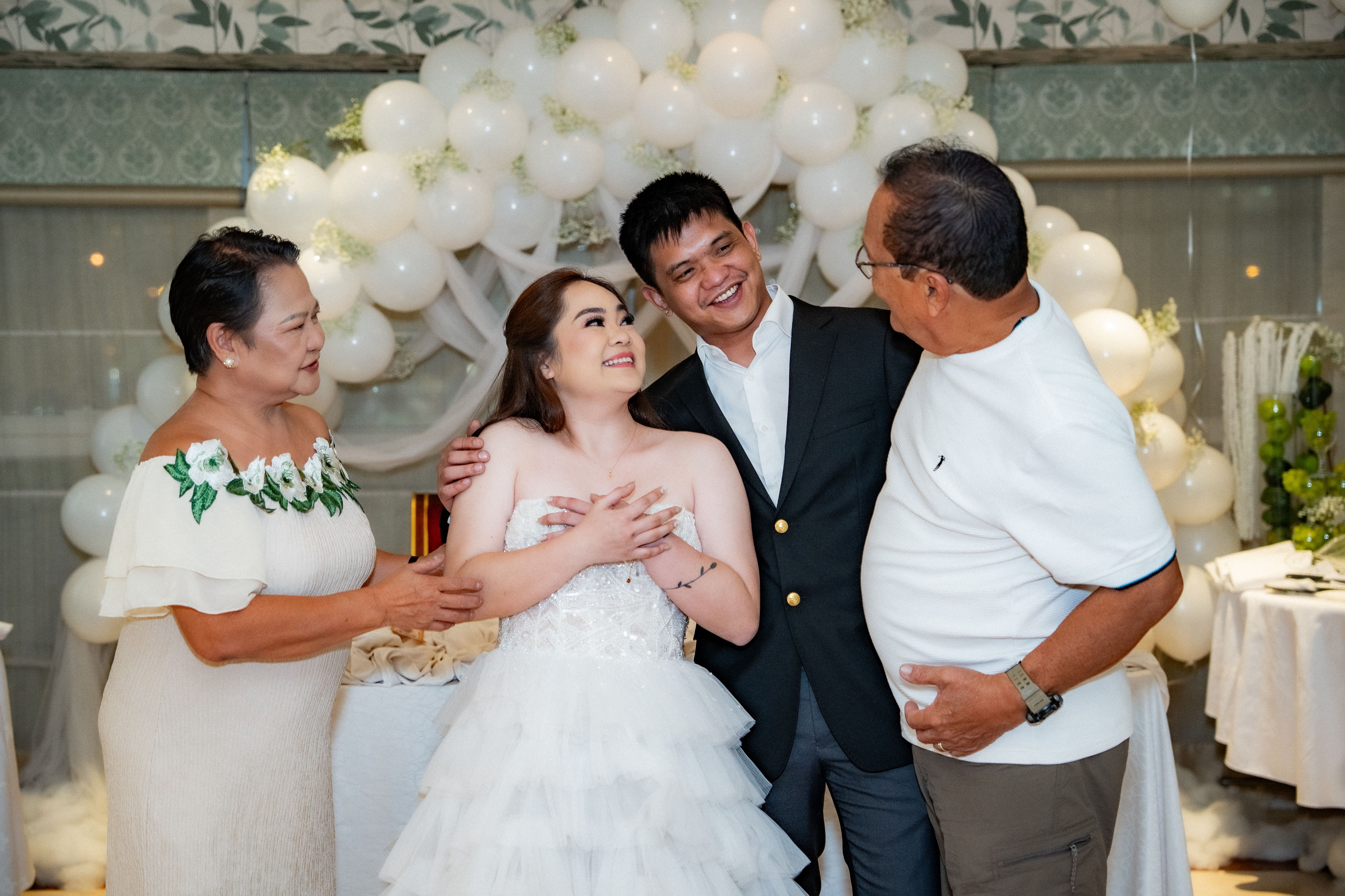 A happy family celebrating a special occasion with joy and laughter, surrounded by elegant decorations.