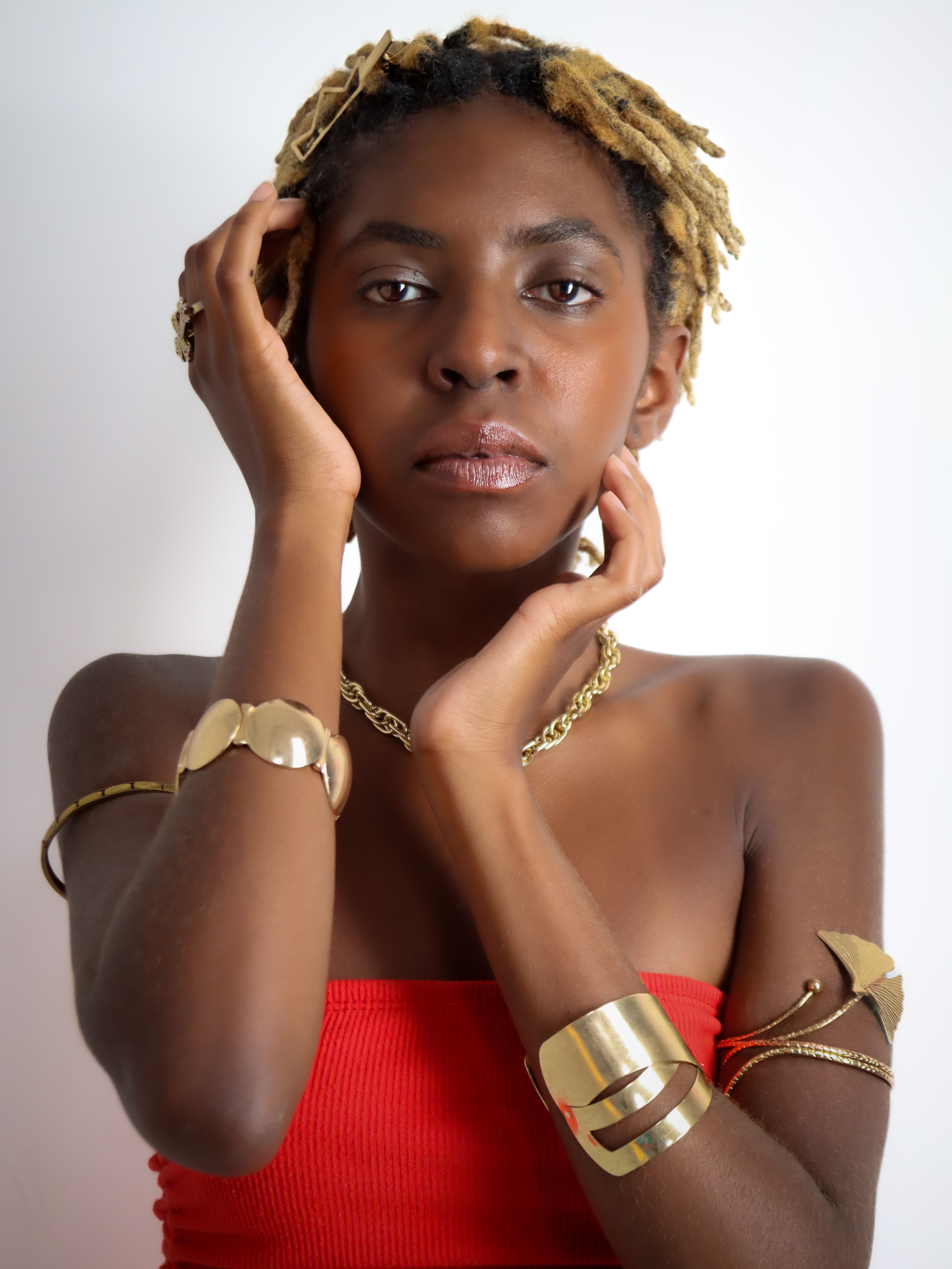 Portrait of a Woman with Gold Accessories · Free Stock Photo