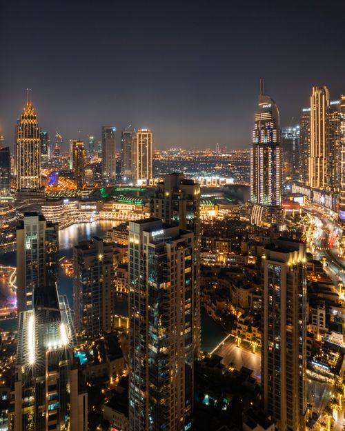 Free Captivating view of Dubai's illuminated skyline featuring iconic skyscrapers at night. Stock Photo