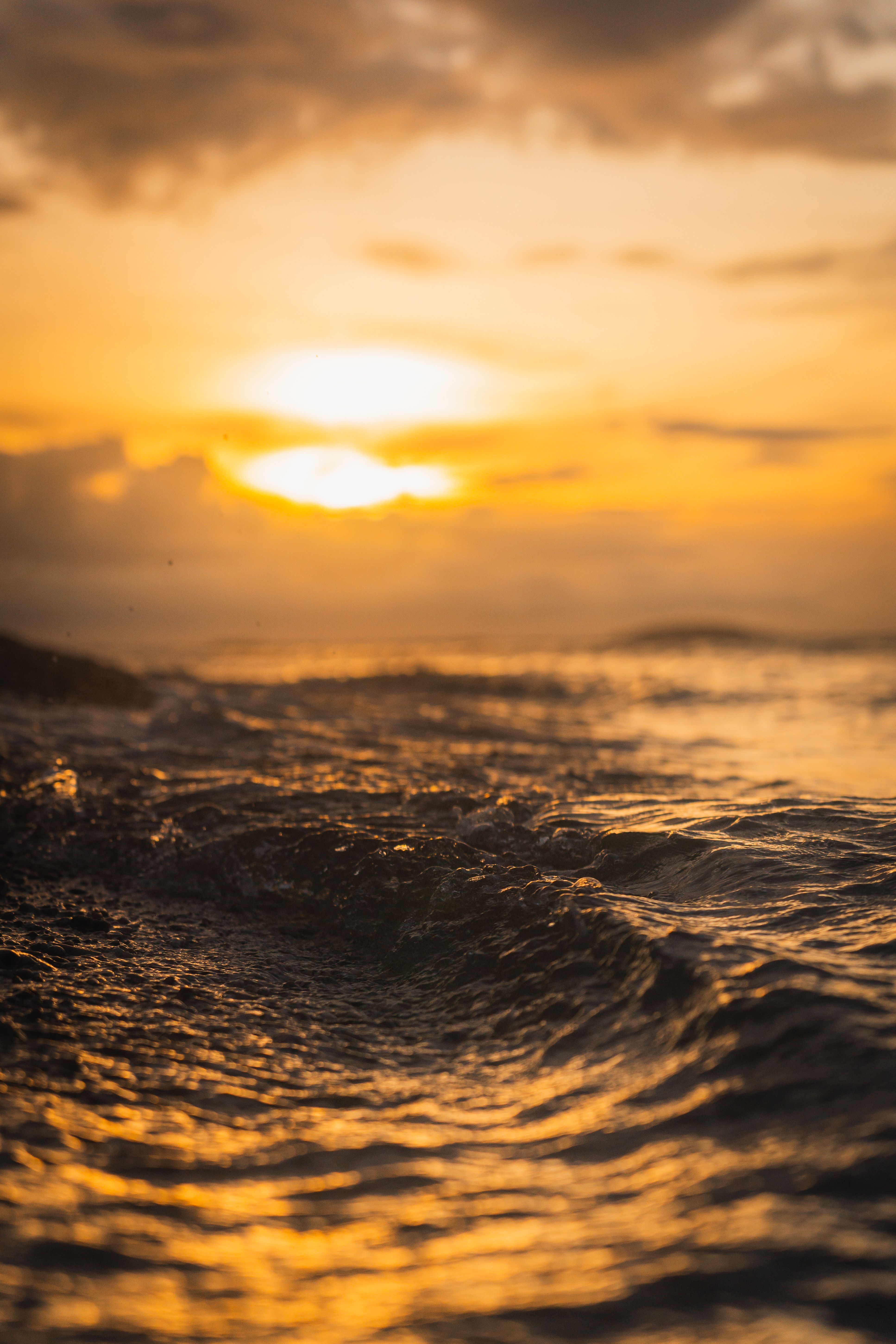 Golden Sunset Over Ocean Waves · Free Stock Photo