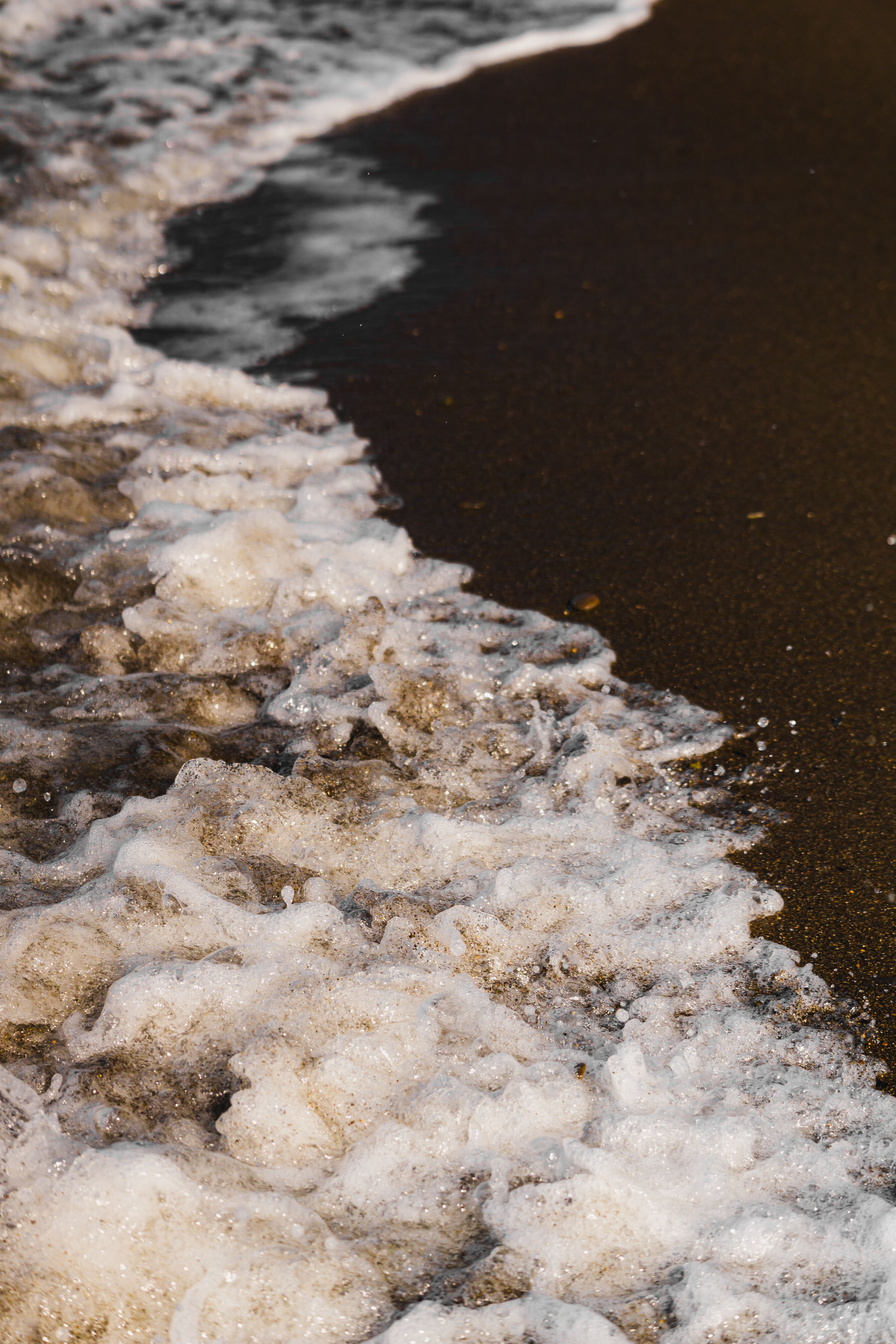 Close-up of Ocean Waves on Sandy Beach · Free Stock Photo