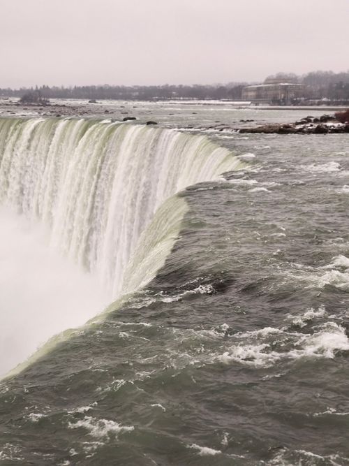 Free Stunning view of Niagara Falls during winter, showcasing powerful cascades and misty atmosphere. Stock Photo