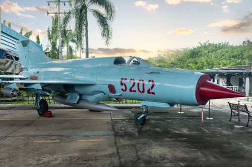 Free Classic military jet displayed outdoors in museum setting. Stock Photo