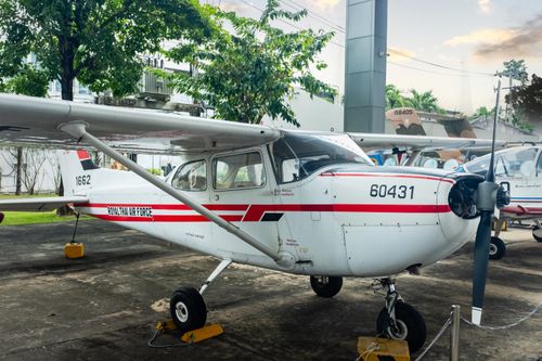 Free Close-up of a white Cessna aircraft parked outdoors showcasing aviation equipment. Stock Photo