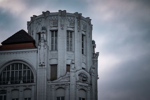 Close-up of an art nouveau building façade in Budapest, Hungary, showcasing intricate architectural details.