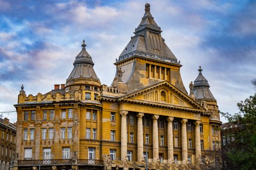 A stunning view of a historic building in Budapest, showcasing its architectural beauty during dusk.