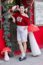 Woman in Red Top Posing with Holiday Decor