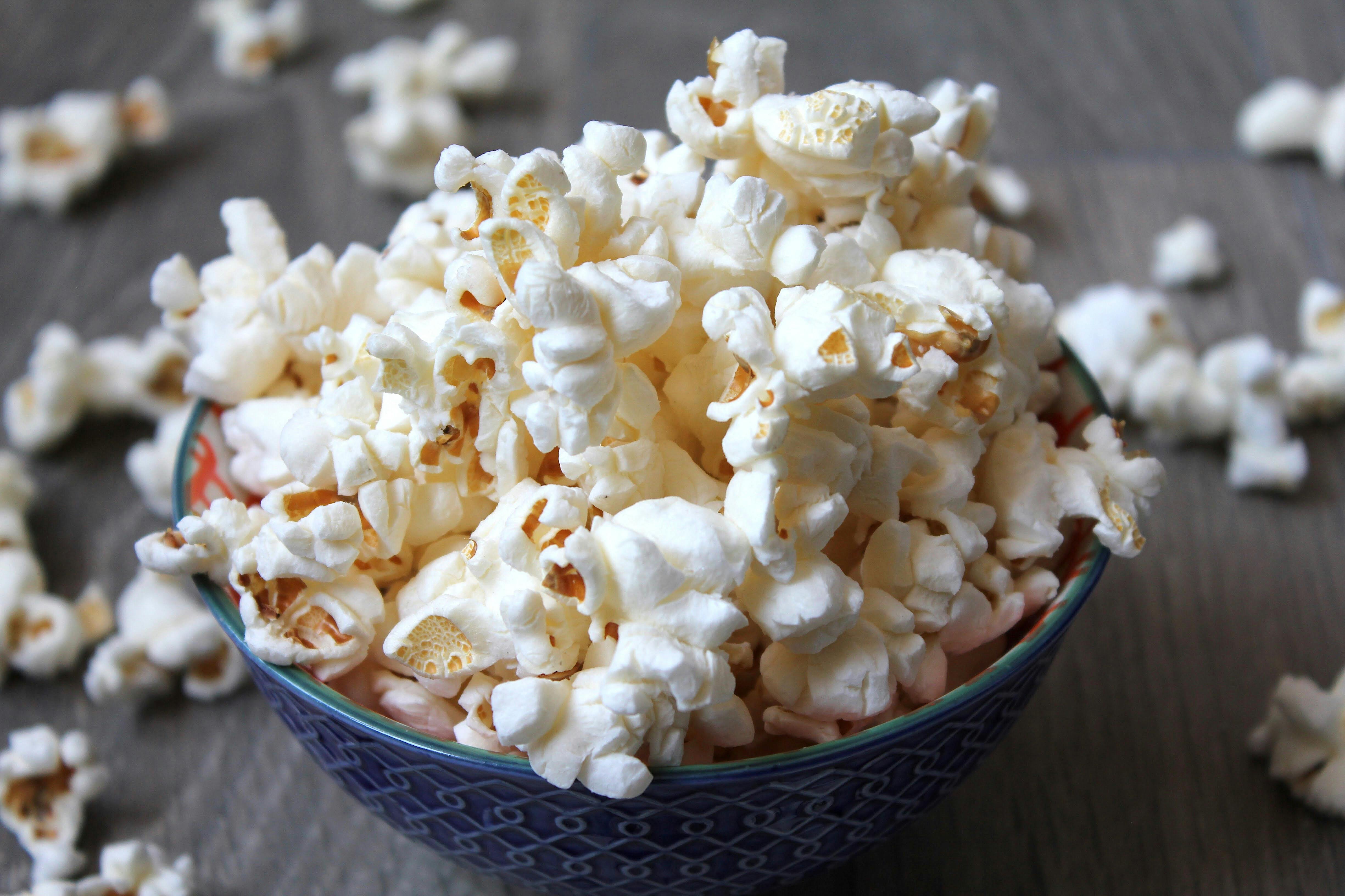 HD wallpaper cooked popcorn snack food buttered salty yellow white  food and drink  Wallpaper Flare