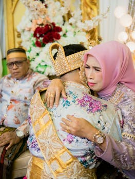 A heartfelt embrace during a traditional wedding ceremony in Kendari, Indonesia.