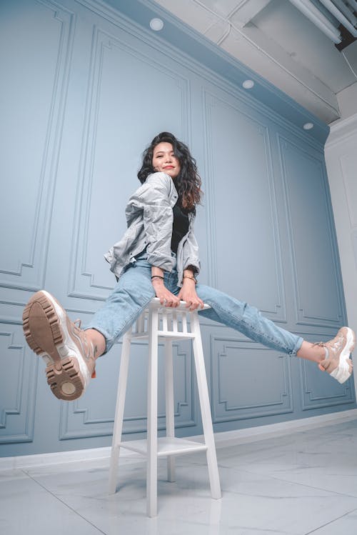 Photo Of Woman Sitting On Stool 