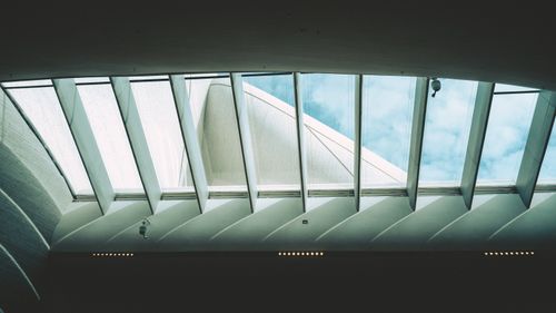 Free A modern architectural skylight with a clear view of the sky displaying innovative design. Stock Photo