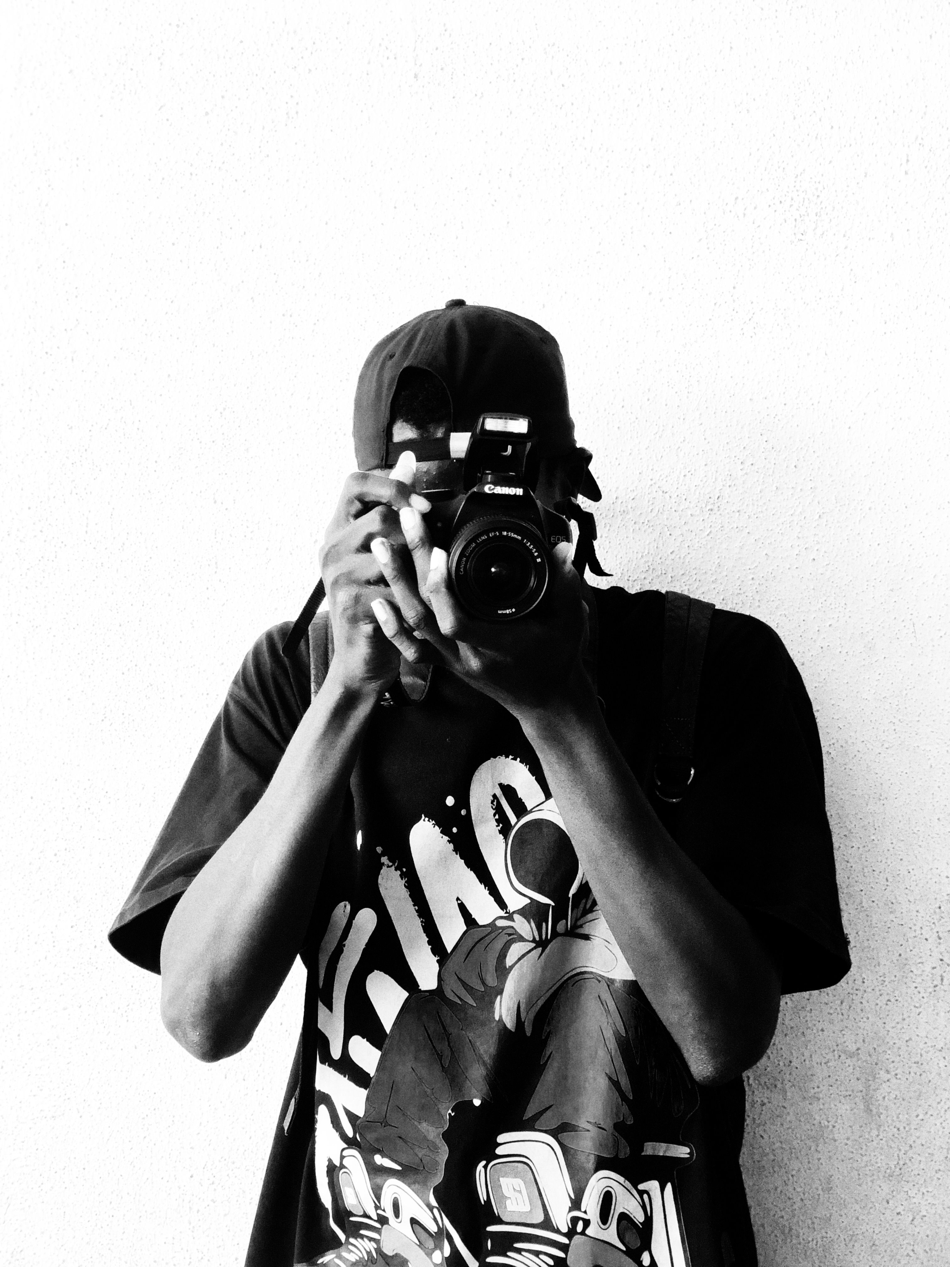 A captivating black and white photo of a photographer capturing a moment.