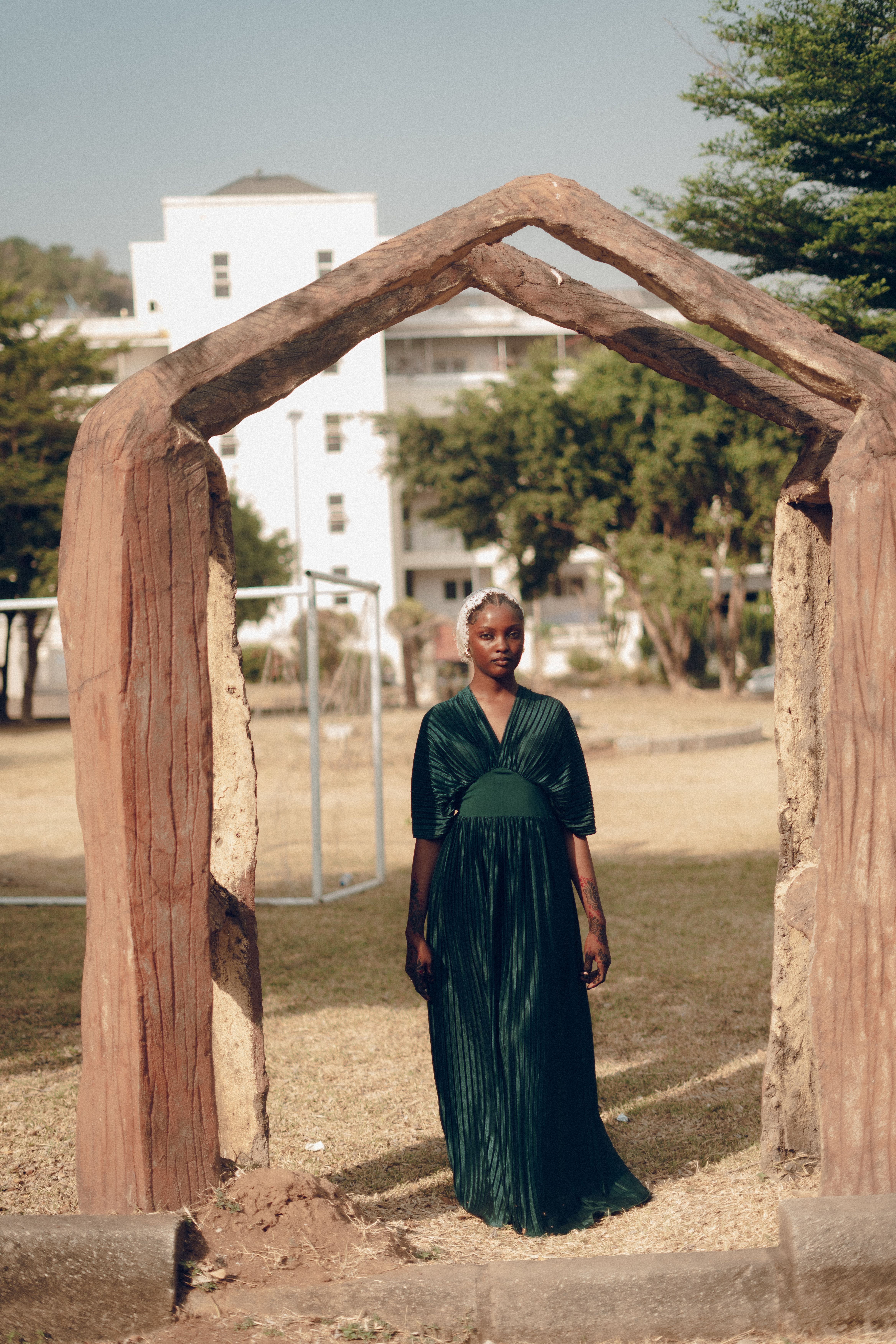 Elegant Portrait of a Woman in Green Dress Outdoors · Free Stock Photo