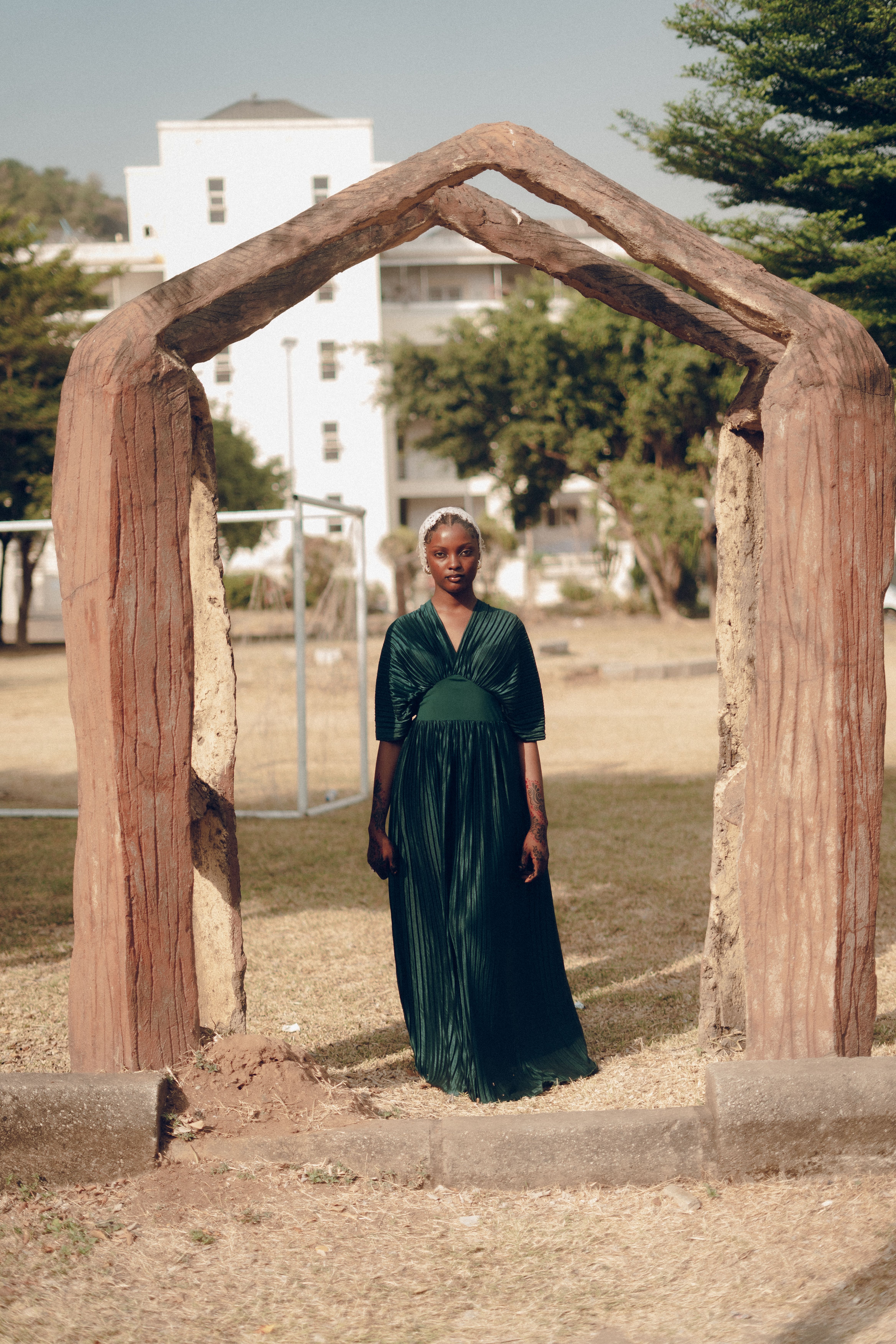 Elegant Woman in Green Dress Standing Outdoors · Free Stock Photo
