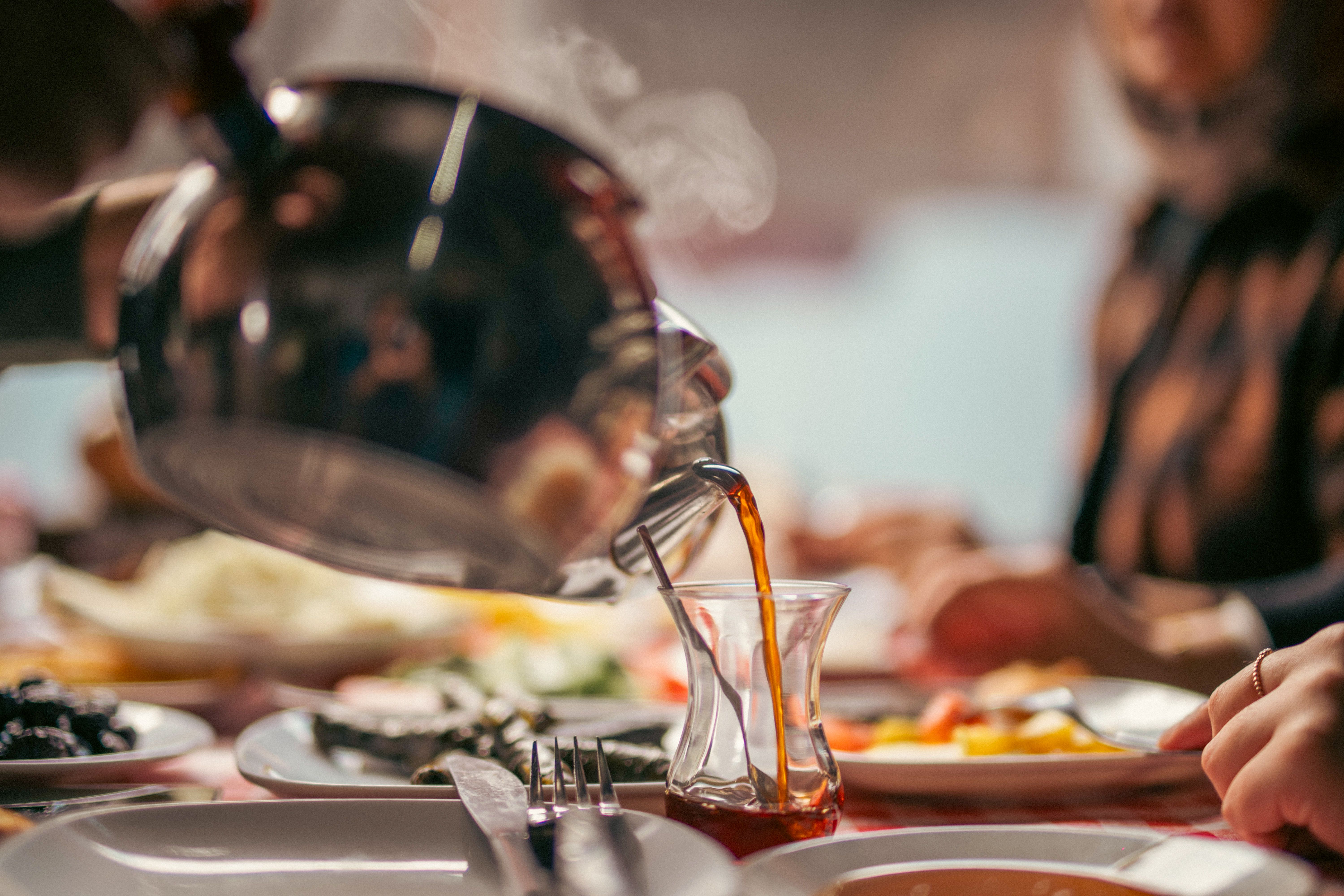 Authentic Turkish Breakfast with Tea Pouring · Free Stock Photo