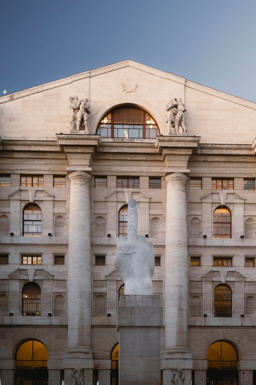 Free Iconic sculpture in front of Palazzo Mezzanotte, Milan, at dusk, capturing the architectural grandeur. Stock Photo