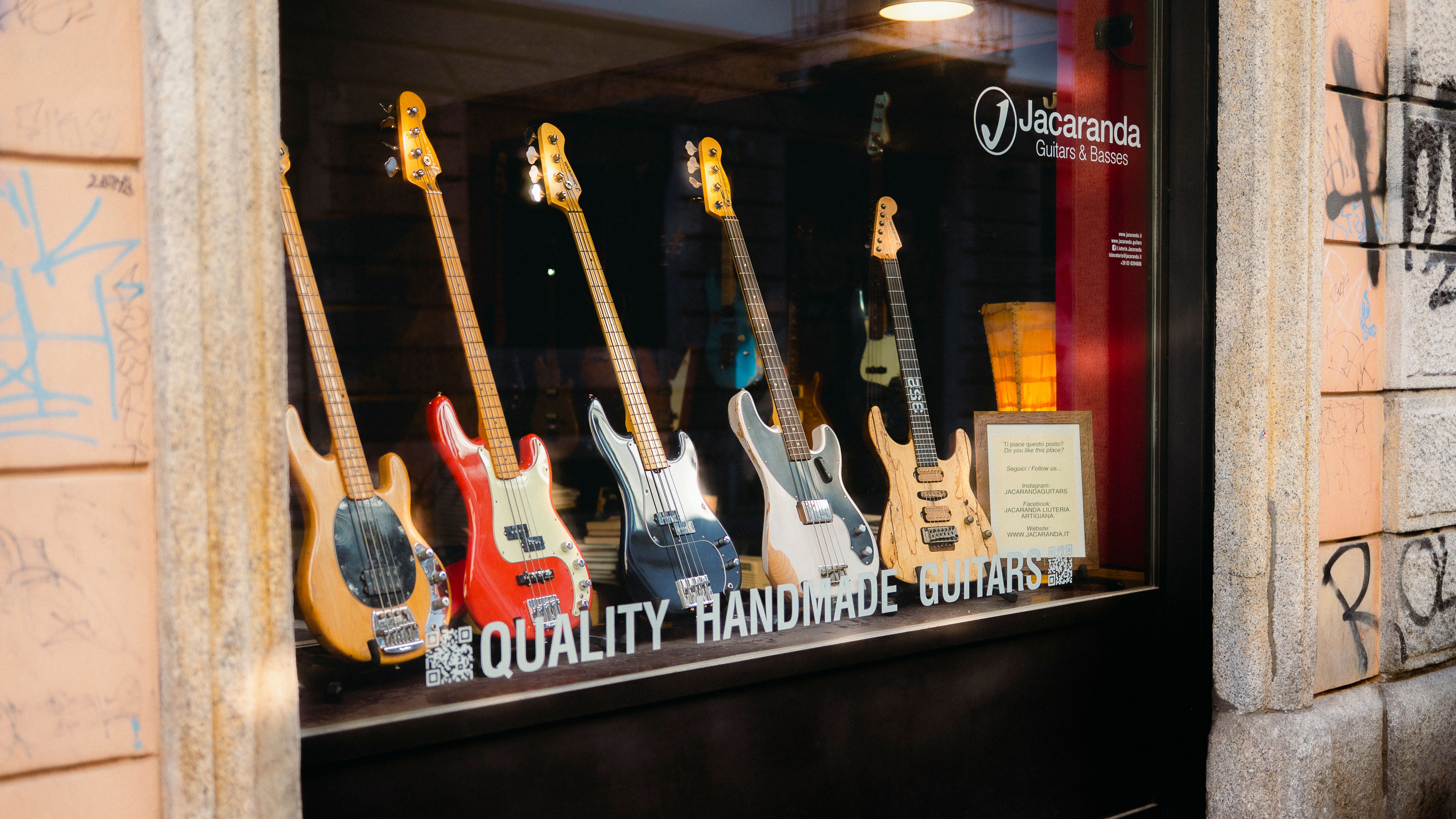 Storefront showcasing quality handmade guitars at Jacaranda Guitars & Basses shop.