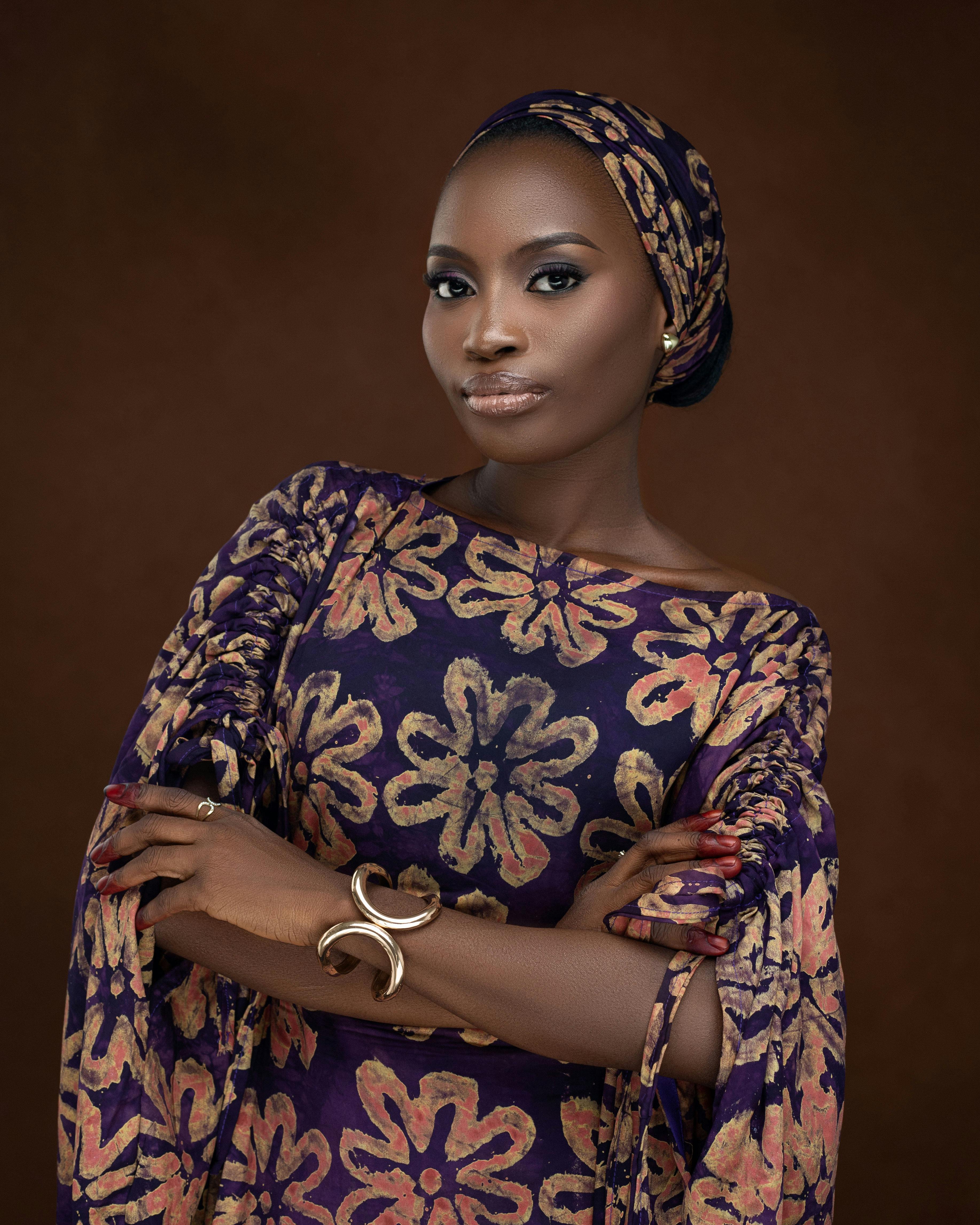 Stunning portrait of a woman wearing a stylish floral-patterned dress, exuding grace.