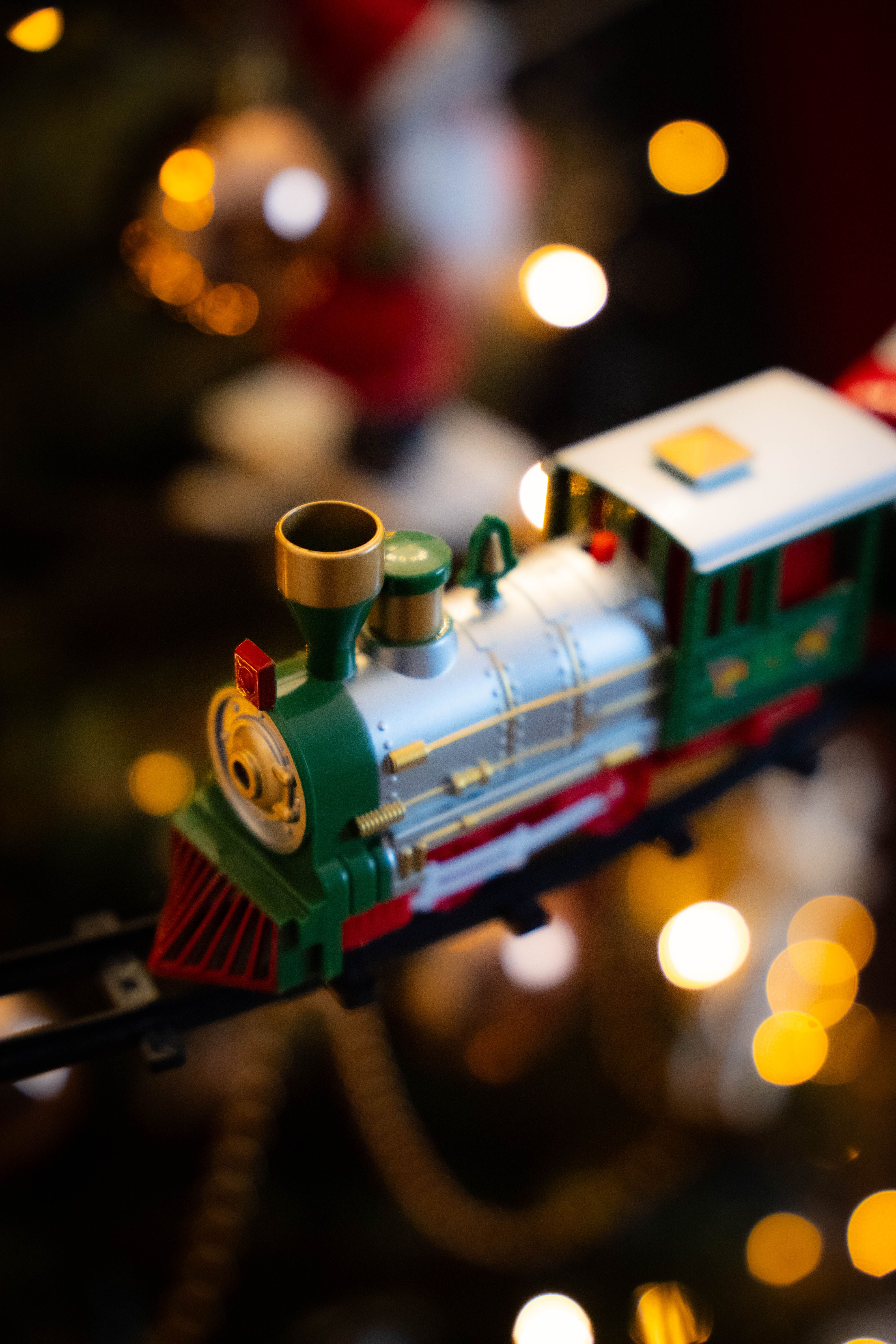 Festive Toy Train with Bokeh Christmas Lights · Free Stock Photo