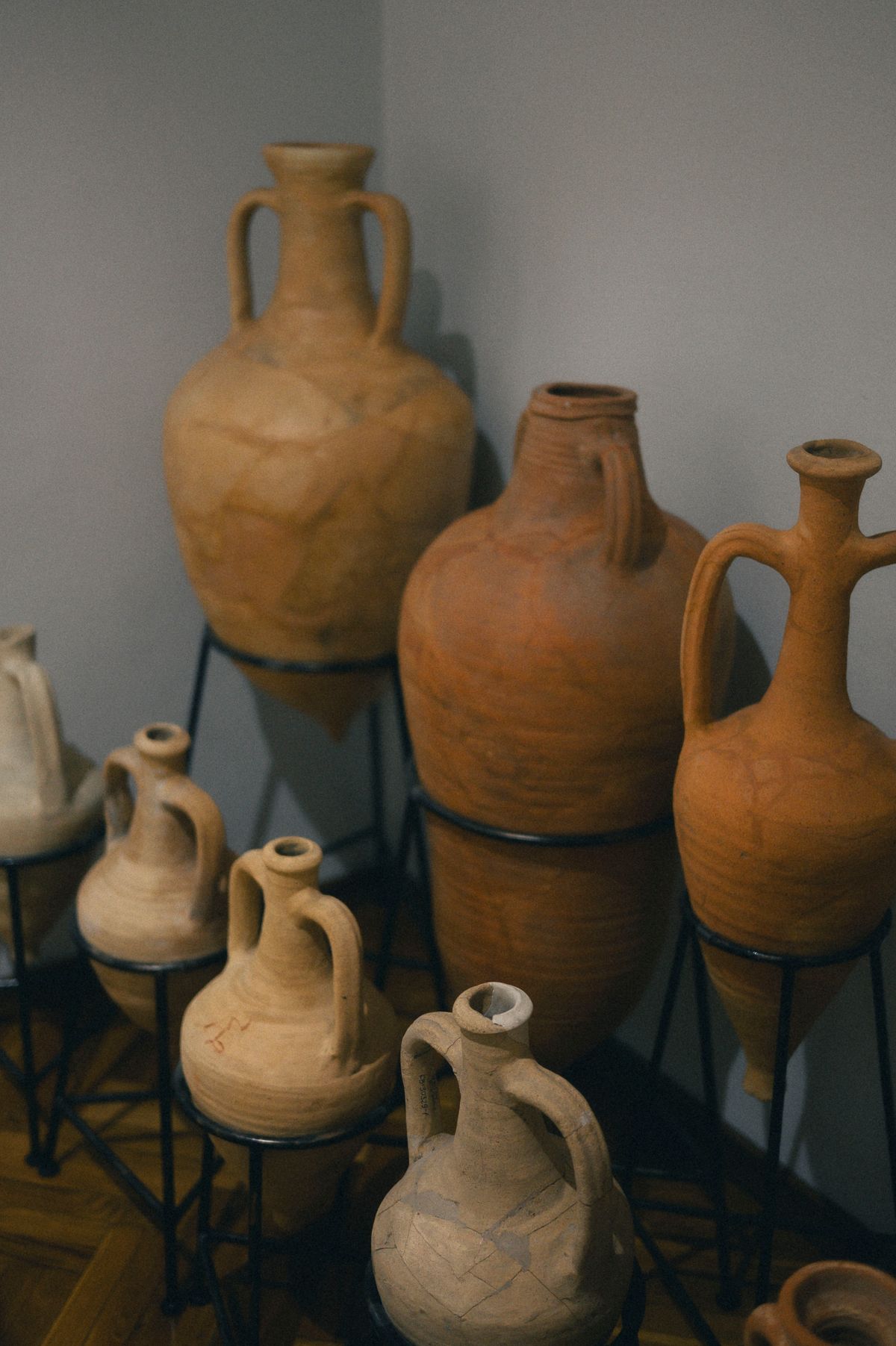 Ancient terracotta vessels in a display case