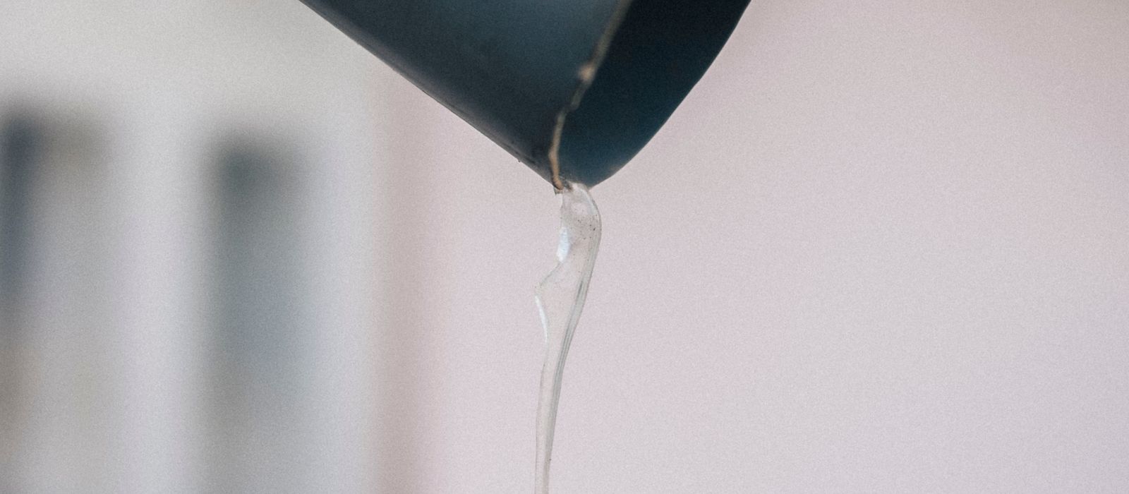 Icicle hanging from a metal gutter