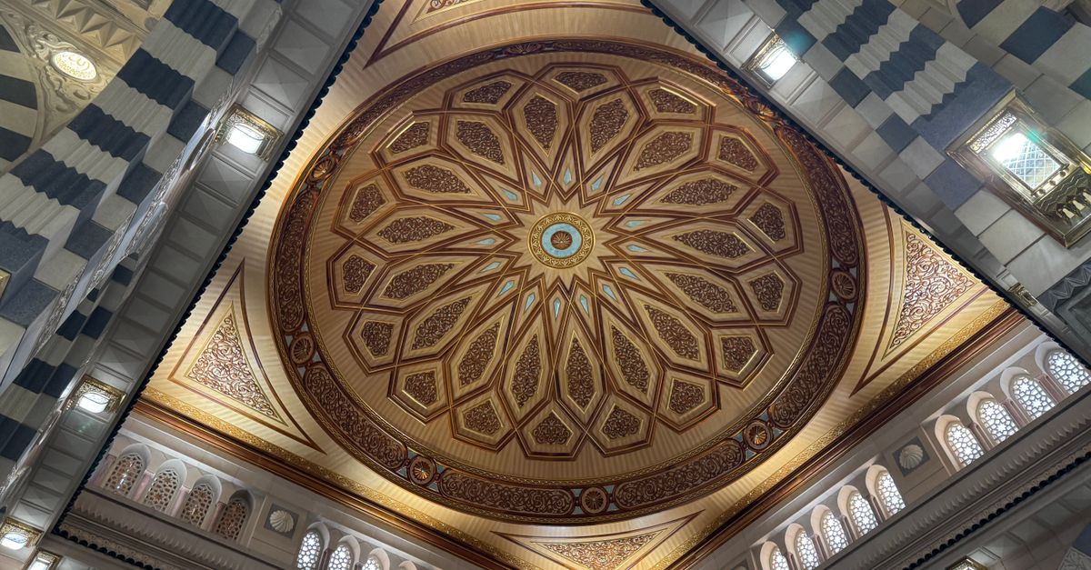 Detailed view of the ornate ceiling dome in a Medina mosque showcasing Islamic architecture.