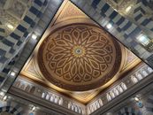 Detailed view of the ornate ceiling dome in a Medina mosque showcasing Islamic architecture.