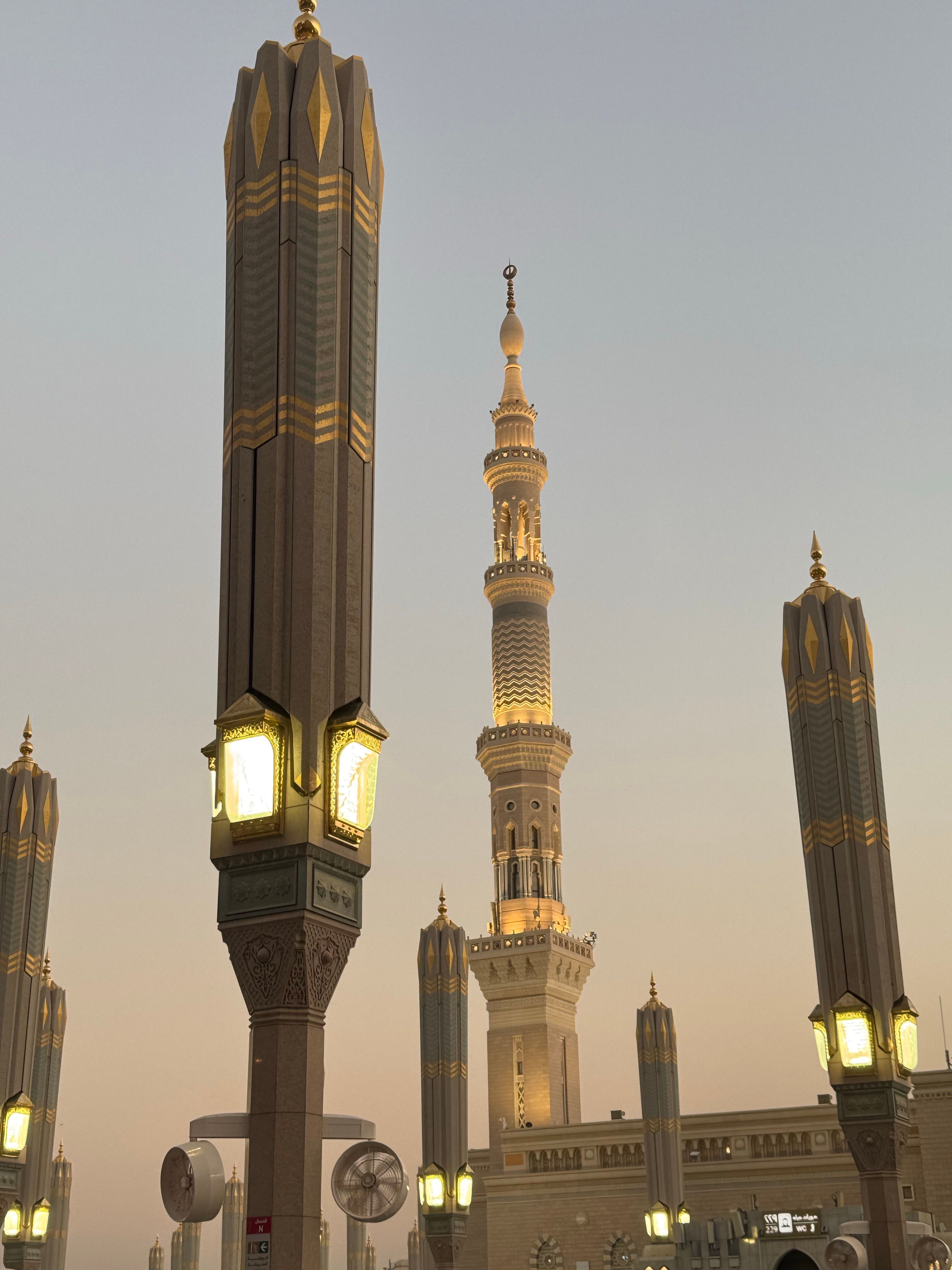 Captivating sunset view of Al-Masjid an-Nabawi's majestic minarets and iconic architecture in Medina, Saudi Arabia.