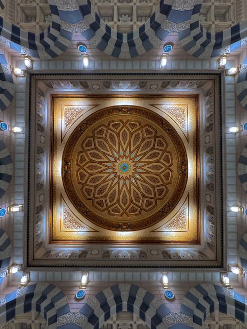 Free Close-up of a beautifully ornate ceiling showcasing Islamic architectural design and intricate patterns. Stock Photo