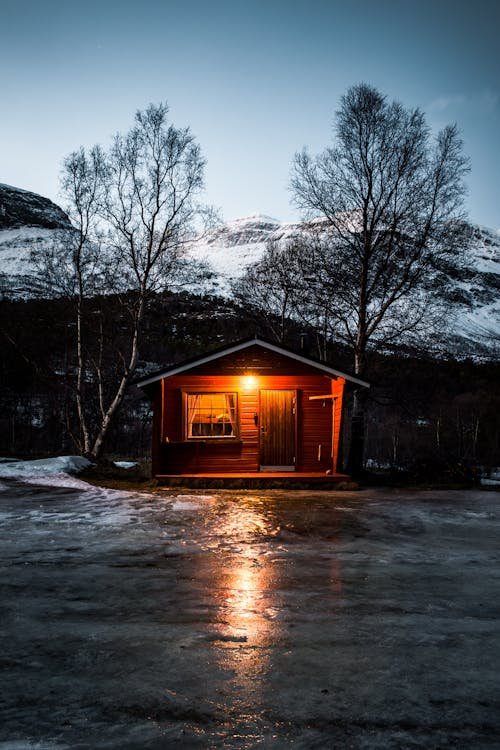 Free House With Turned-on Light Stock Photo