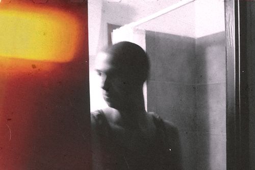 Free Blurred abstract portrait of a bald man in a bathroom with distorted light effects in Sardinia, Italy. Stock Photo