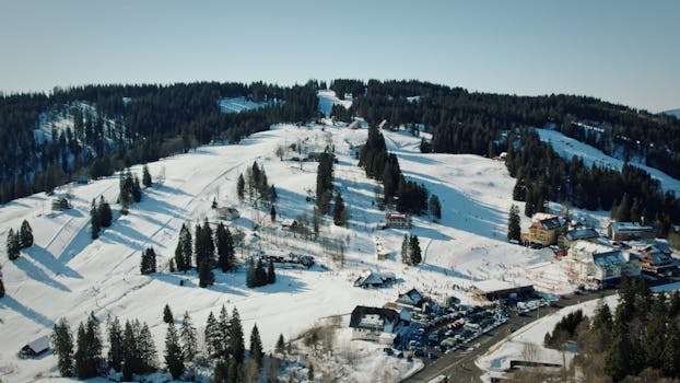 Snowy landscape of Feldberg, Germany captured from above, showcasing a winter wonderland with forests and hills.