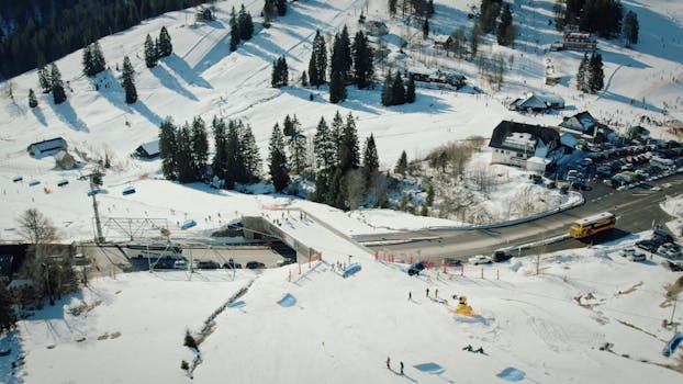 Aerial view of Feldberg ski resort with snow-covered landscapes and ski activities.