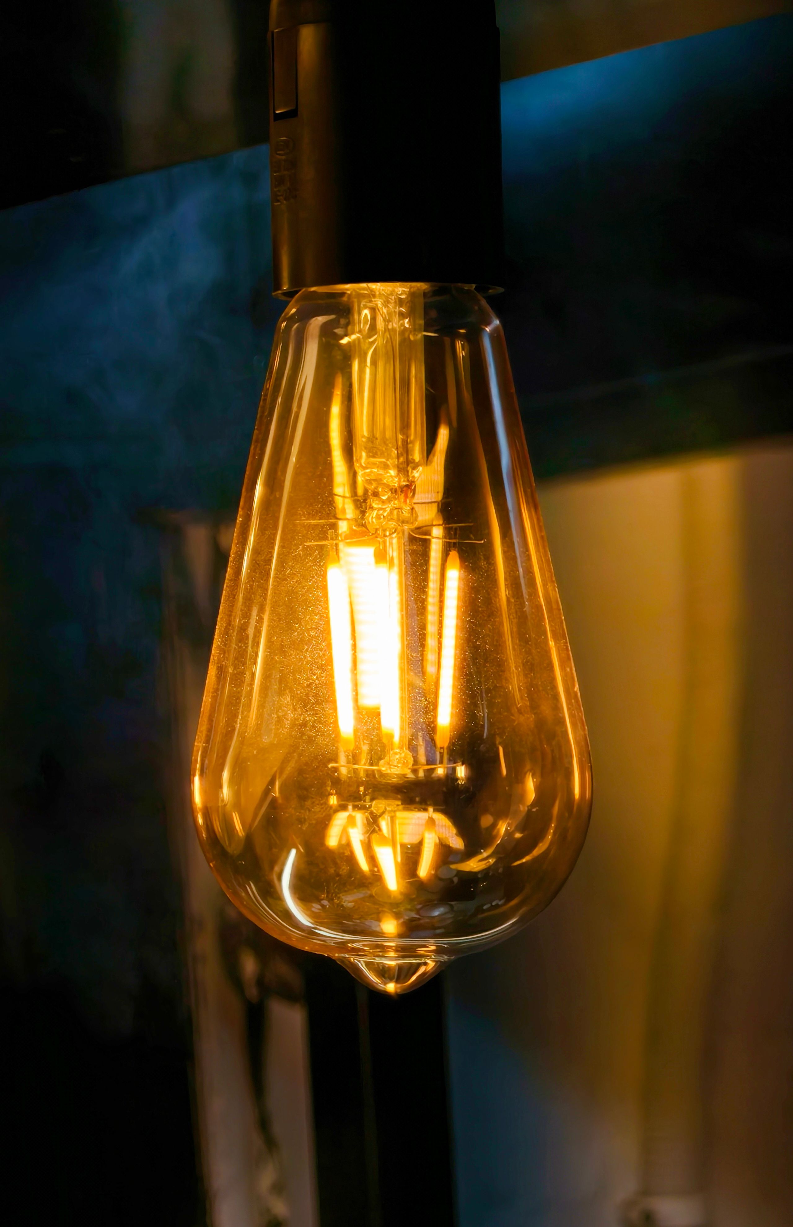 Warm glowing Edison bulb close-up, perfect for industrial and vintage themes.